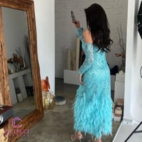 فستان سهرة تركوازي تطريز وريش فاخر