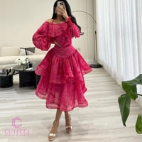 فستان سهرة وردي مموج بطبقات