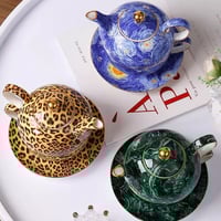 إبريق شاي عالي الجودة مع صحن وكوب