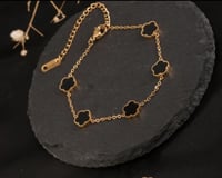 سوار الأزهار الذهبي لون أسود