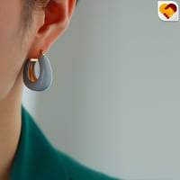 حلق دائري باللون الاصفر والرصاصي