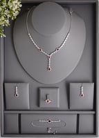 طقم زفاف أنيق مرصع بالزركون سويسري مع أحجار حمراء