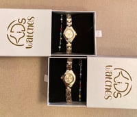 ساعة مواليد فضي وذهبي