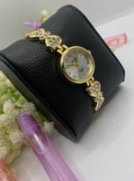 ساعة بنات ذهبي فيونكة