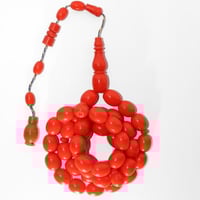 مسباح بكلايت برتقالي بقصة بيضاوية