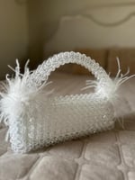 شنطة بالخرز والريش