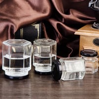 علب زجاج سداسي جمله فضي واسود