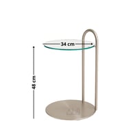 طاولة جانبية أنيقة بسطح زجاجي شفاف وقاعدة استيل لا...