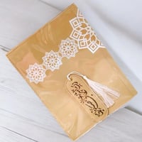 مجموعة من 12 قطعة من غلاف جلدي للمصحف مع فاصل بالل...