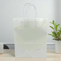 مجموعة (12) من اكياس توزيعات ورقية باللون الابيض