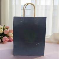 مجموعة (12) من اكياس توزيعات ورقية باللون الاسود م...