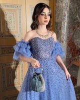 فستان سهرة مطرز باللؤلؤ