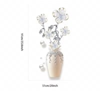 قطعة فنية جدارية زخرفية، عبارة عن مزهرية مزينة بأز...