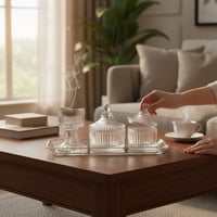 طقم ضيافة زجاج يحتوي على صينية فيها مبخرة وتمرية و...