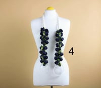 عقد زهرة تخرج بالاسم