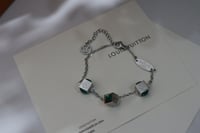 اسورة lv سلفر بفصوص اخضر