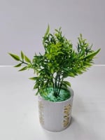 Faux Green Plant in Decorative White Pot نبات أخضر...