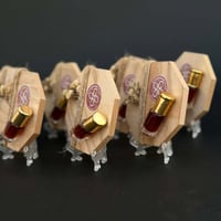 توزيعات عود بقاعدة خشبية - 12 حبة