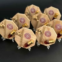 توزيعات عود بقاعدة خشبية - 12 حبة