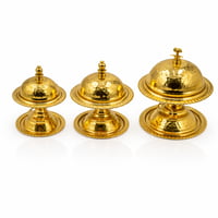 الفخامة في أدق التفاصيل: تمرايات ذهبية بغطاء ذهبي