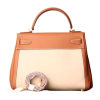 شنطة كيلي جلد جودة عالية باللون البرتقالي