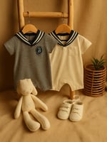 طقم مواليد فخم من NEXT – تنسيق بحري أنيق لهدية است...