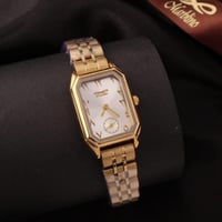 ساعة ذهبية بارقام عربية