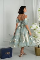 فستان سهرة أنيق بقصة أوف شولدر ولمسة فاخرة