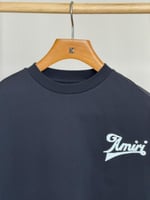 تي شيرت AMIRI رجالي لون اسود وشعار أبيض