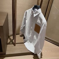 قميص لويفي وايت مخطط بجيب عسلي