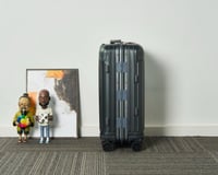 شنطة سفر بعجلات من ريموا Cabin Twist Suitcase لون...
