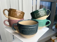 كوب سيراميك بمسكة مع كتابة عربية - 250 مل | الوان...