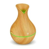 جهاز فواحة عطرية أنيقة بشكل مزهرية مع إضاءة خافته...