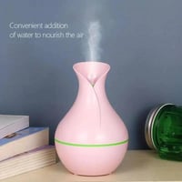 جهاز فواحة عطرية أنيقة بشكل مزهرية مع إضاءة خافته...