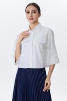 بلوزة كاجوال مخططة بأزرار وجيب