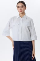 بلوزة كاجوال مخططة بأزرار وجيب