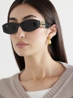 نظارة ميو ميو بإطار بيضاوي