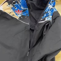 جاكيت مانشستر يونايتد 2025-2026 اسود