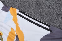 طقم تدريب شتوي ريال مدريد 2024-2025 ابيض و برتقالي