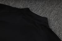 طقم تدريب شتوي ريال مدريد 2025-2026 اسود سحاب كامل