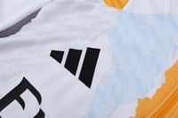 طقم تدريب شتوي ريال مدريد 2024-2025 ابيض و برتقالي