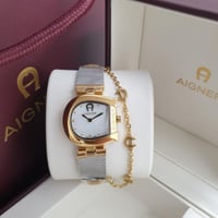 ساعه اقنر نسائي فضي مع ذهبي مينا ابيض