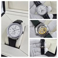 ساعة رولكس جلد اسود مع فضي مينا ابيض