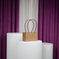 أكياس علاقي كرتوني وسط درزن