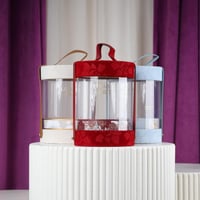 علب دائري شفاف عنابي