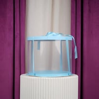 علب كيك وهدايا دائري شفافة سماوي وسط