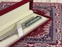 قلم سانتوس مموج اخضر