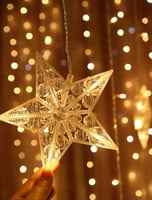 إضاءة ستارة بأشكال نجوم وهلال باضاءة صفراء