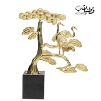 تحفه منزليه بلون ذهبي على شكل شجرة