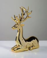 تحفه غزال بلون ذهبي جالس